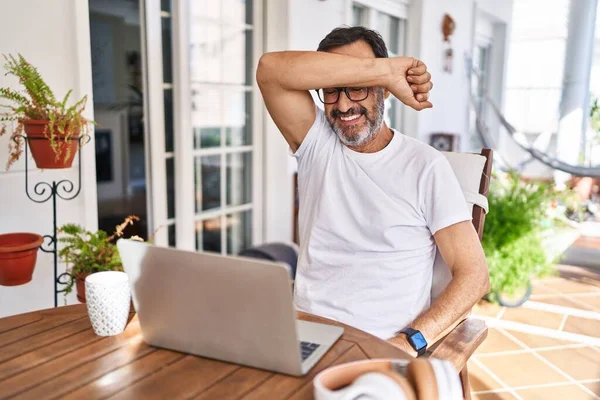 Middle Age Man Using Computer Laptop Home Covering Eyes Arm — Stock Photo, Image