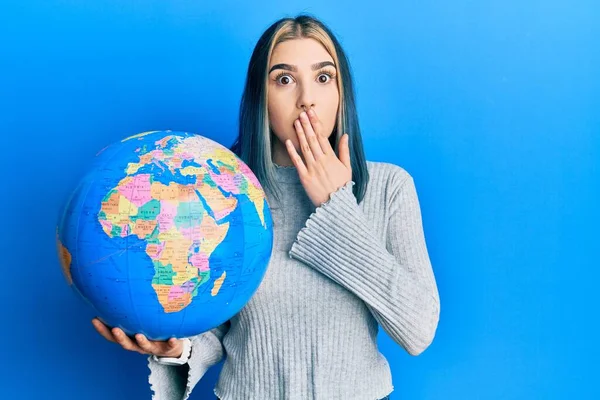 Young Modern Girl Holding World Ball Covering Mouth Hand Shocked — Stock Photo, Image