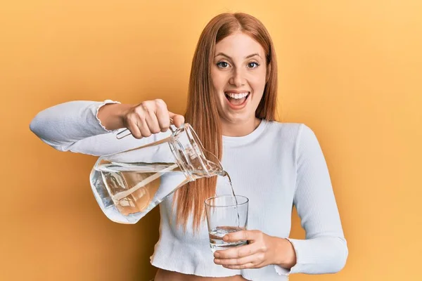 Young Irish Woman Pouring Water Smiling Laughing Hard Out Loud — 스톡 사진