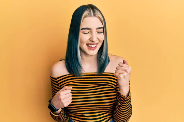 Young Modern Girl Wearing Casual Striped Shirt Celebrating Surprised Amazed — 스톡 사진