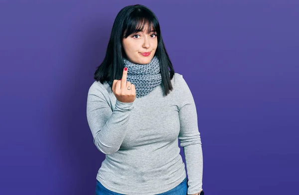 Young Hispanic Size Woman Wearing Winter Scarf Showing Middle Finger — Stok Foto