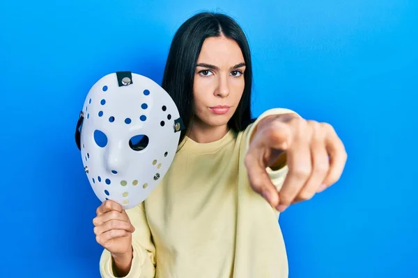 Young Brunette Woman Holding Hockey Mask Pointing Finger Camera You — ストック写真