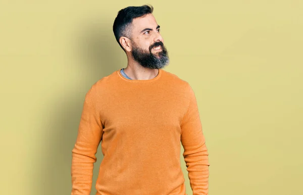Hispanic Man Beard Wearing Casual Winter Sweater Looking Away Side — стоковое фото