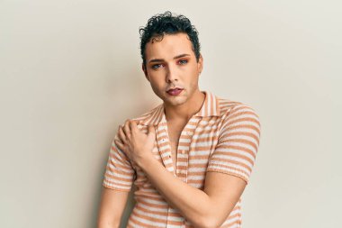 Handsome man wearing make up wearing casual shirt annoyed and frustrated shouting with anger, yelling crazy with anger and hand raised 