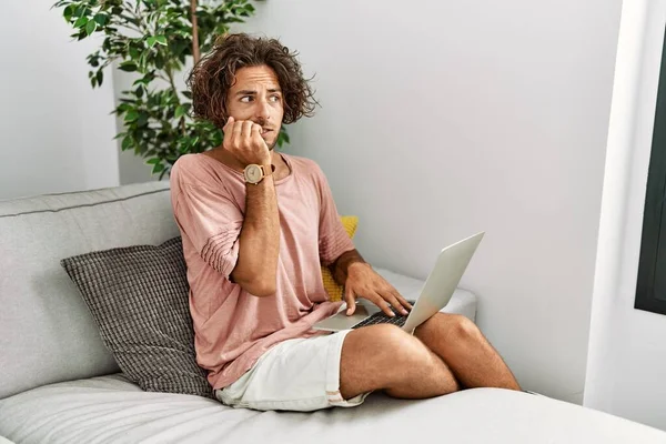 Young Hispanic Man Sitting Sofa Home Using Laptop Looking Stressed — Stok fotoğraf