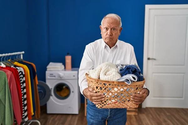 Senior Man Grey Hair Holding Laundry Basket Home Skeptic Nervous — Stock Photo, Image