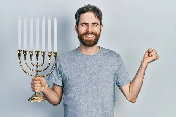 Caucasian Man Beard Holding Menorah Hanukkah Jewish Candle Screaming Proud — стокове фото