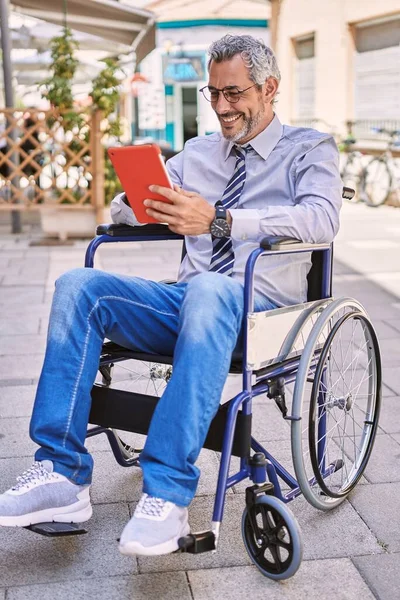 Middle Age Hispanic Man Sitting Wheelchair Using Touchpad Street — Stok fotoğraf