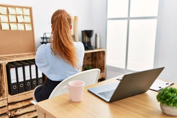Young Redhead Woman Working Office Using Computer Laptop Standing Backwards — Foto de Stock