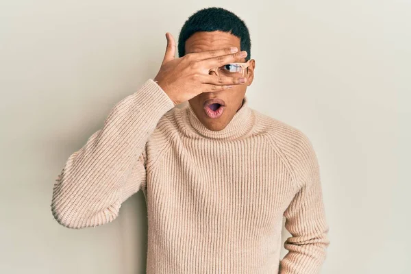 Young Handsome Hispanic Man Wearing Turtleneck Neck Sweater Glasses Peeking — стоковое фото