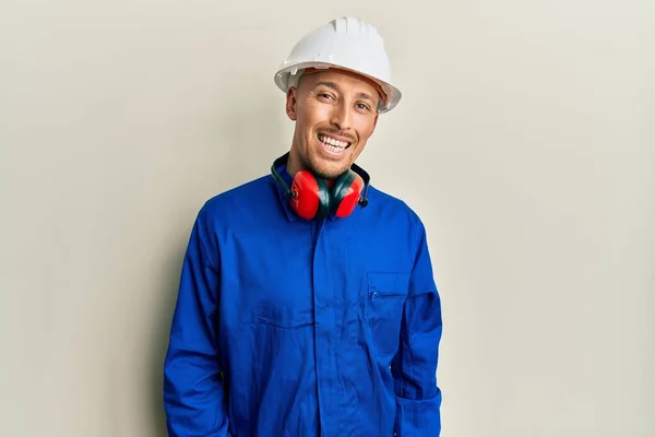 Bald Man Beard Wearing Builder Jumpsuit Uniform Hardhat Looking Positive — стоковое фото
