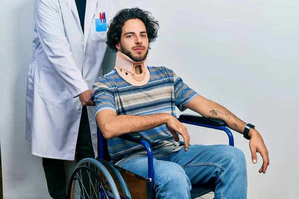 Handsome Hispanic Man Sitting Wheelchair Wearing Neck Collar Relaxed Serious — Fotografia de Stock