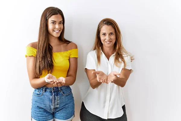 Mother Daughter Together Standing Together Isolated Background Smiling Hands Palms — Stockfoto