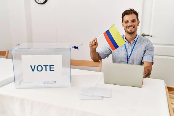 Young Hispanic Man Smiling Confident Holding Colombia Flag Working Electoral — Stock Photo, Image