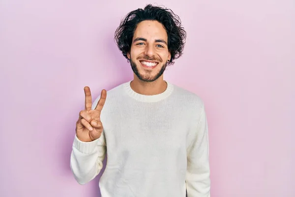 Handsome Hispanic Man Wearing Casual White Sweater Showing Pointing Fingers — Fotografia de Stock