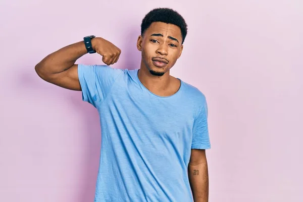 Young African American Man Wearing Casual Blue Shirt Strong Person — ストック写真