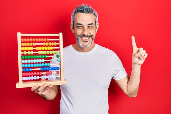 Handsome Middle Age Man Grey Hair Holding Traditional Abacus Smiling — Stok fotoğraf