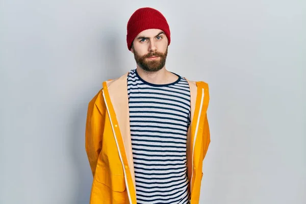 Caucasian Man Beard Wearing Yellow Raincoat Skeptic Nervous Frowning Upset — Zdjęcie stockowe