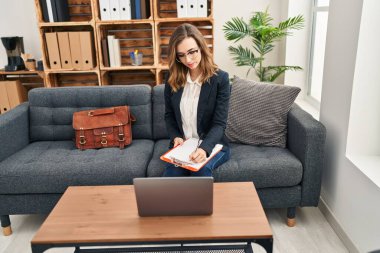 Young woman having online psychology session at clinic