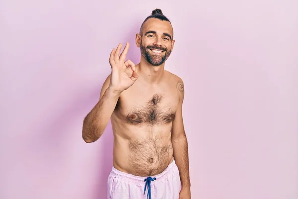 Young Hispanic Man Shirtless Wearing Swimsuit Smiling Positive Doing Sign — Foto de Stock