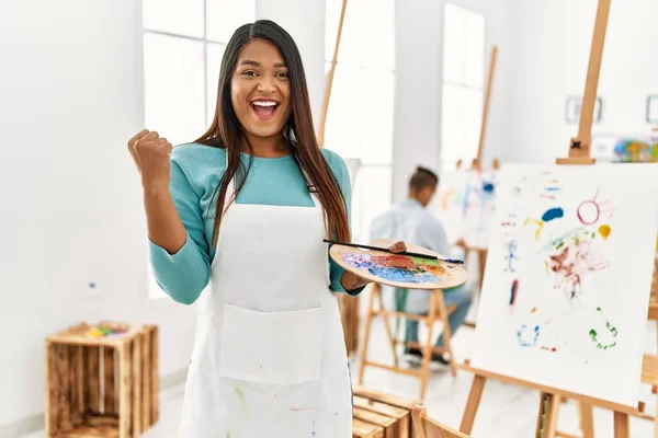 Young Latin Woman Standing Art Studio Screaming Proud Celebrating Victory — Fotografia de Stock