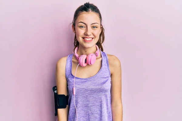 Young Brunette Woman Wearing Sportswear Headphones Happy Cool Smile Face — Stockfoto