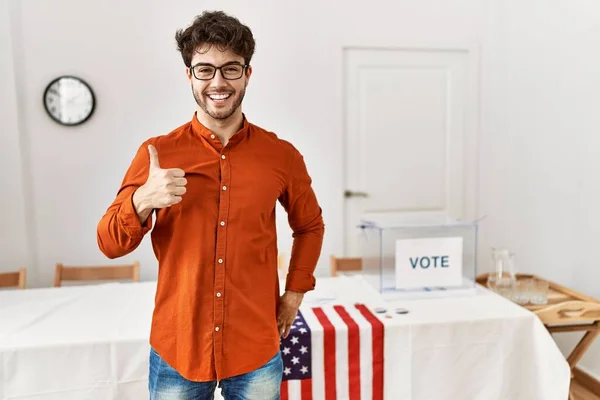 Hispanic Man Standing Election Room Doing Happy Thumbs Gesture Hand — Stockfoto