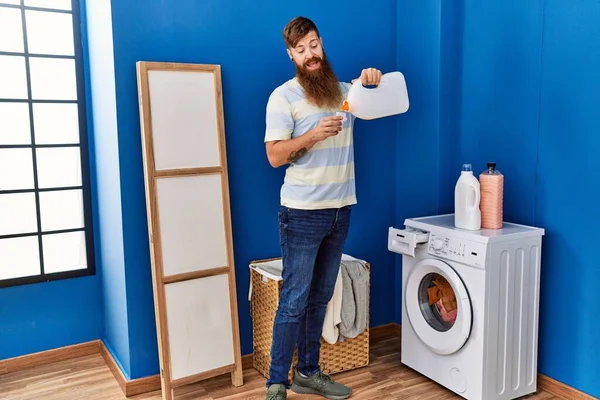 Young Redhead Man Smiling Confident Pouring Detergent Laundry Room — Fotografia de Stock