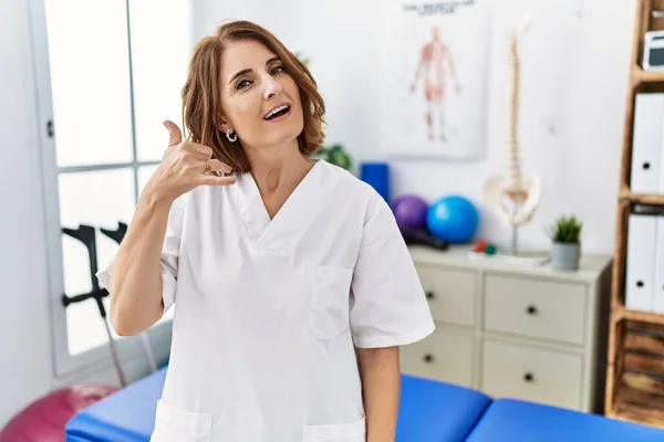 Middle Age Physiotherapist Woman Working Pain Recovery Clinic Smiling Doing —  Fotos de Stock