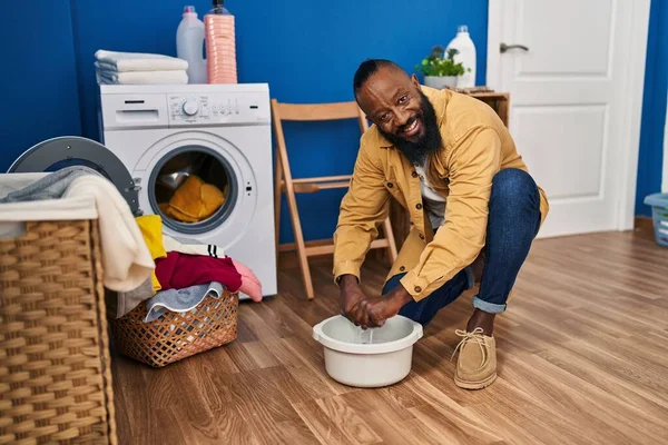 Young African American Man Cleaning Cloth Cube Water Laundry Room — Stok fotoğraf