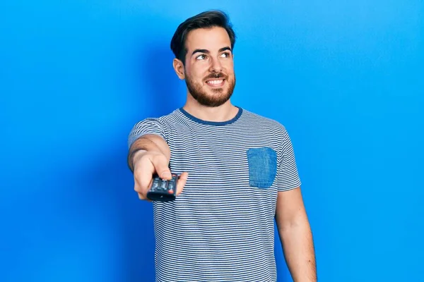 Handsome Caucasian Man Beard Holding Television Remote Control Smiling Looking — Stock Photo, Image