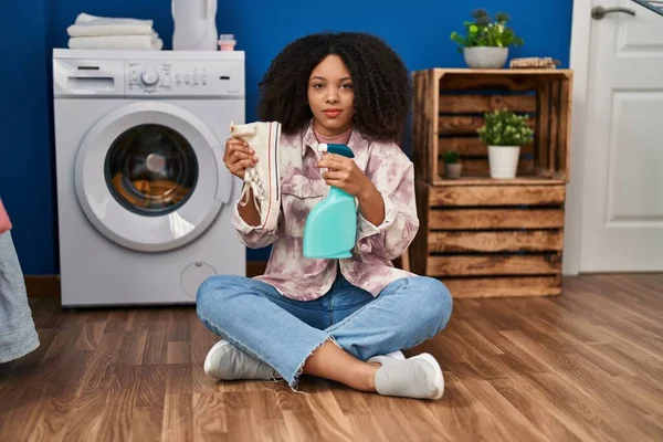 Young African American Woman Cleaning Shoes Laundry Room Relaxed Serious — Fotografia de Stock