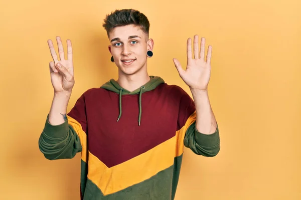 Young Caucasian Boy Ears Dilation Wearing Casual Sweatshirt Showing Pointing — Stock Photo, Image