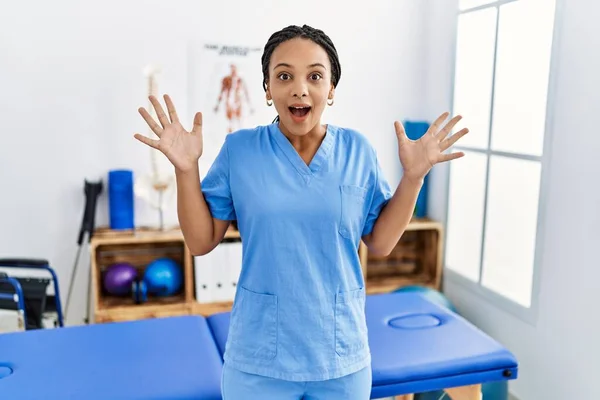 Young African American Woman Working Pain Recovery Clinic Celebrating Crazy — Foto Stock