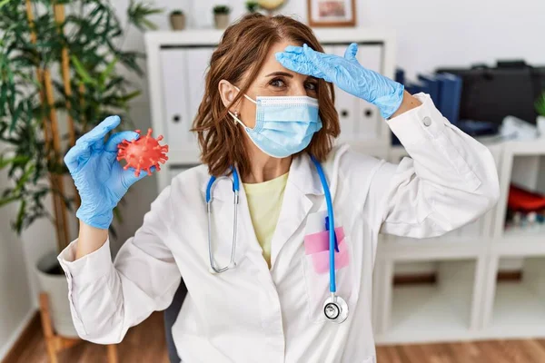 Middle Age Doctor Woman Wearing Safety Mask Holding Virus Toy — Stok fotoğraf