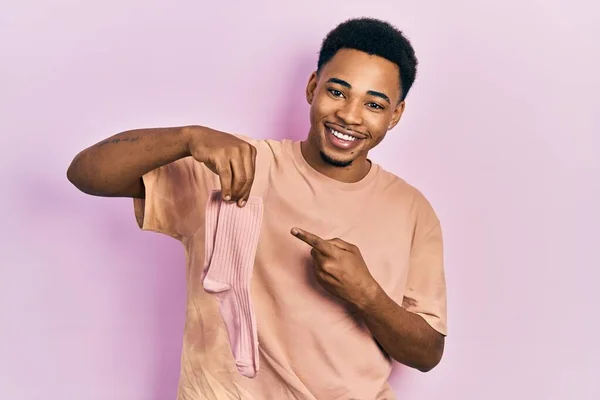 Young African American Man Holding Socks Smiling Happy Pointing Hand — ストック写真