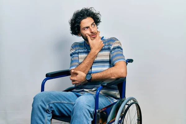 Handsome Hispanic Man Sitting Wheelchair Thinking Worried Question Concerned Nervous — Fotografia de Stock