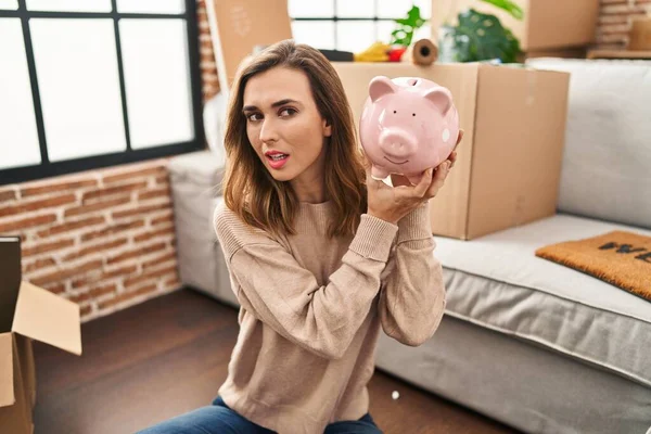 Young Woman Holding Piggy Bank New Home — 스톡 사진