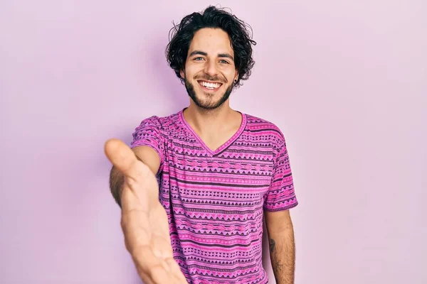 Handsome Hispanic Man Wearing Casual Pink Shirt Smiling Friendly Offering — Stok fotoğraf