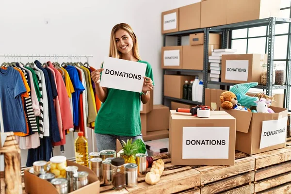 Young Caucasian Volunteer Girl Smiling Happy Holding Donations Banner Charity — 스톡 사진