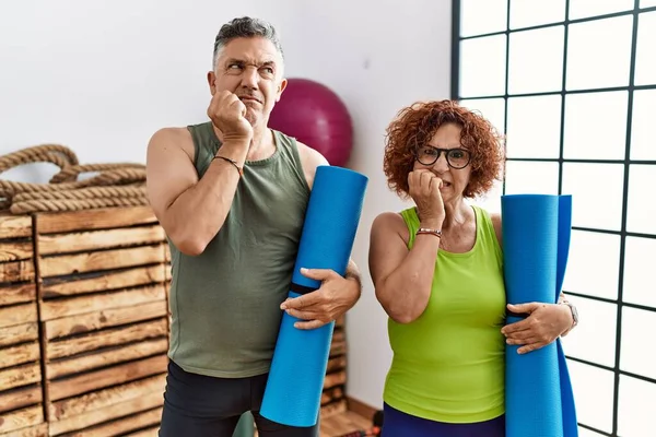 Middle Age Couple Holding Yoga Mat Looking Stressed Nervous Hands — ストック写真