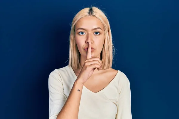 Beautiful Blonde Woman Wearing Casual Sweater Asking Quiet Finger Lips —  Fotos de Stock