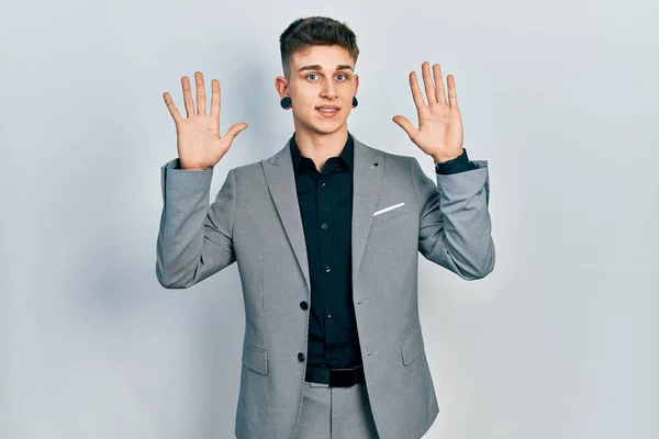 Young Caucasian Boy Ears Dilation Wearing Business Jacket Showing Pointing — Stok fotoğraf