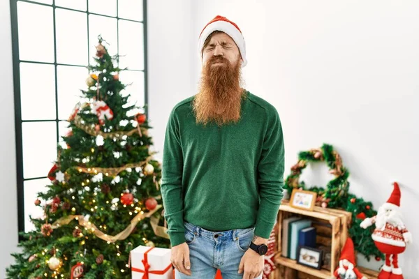 Redhead Man Long Beard Wearing Christmas Hat Christmas Tree Puffing — Photo