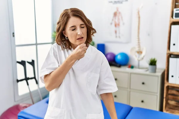 Middle Age Physiotherapist Woman Working Pain Recovery Clinic Feeling Unwell — 图库照片