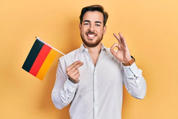 Handsome Caucasian Man Beard Holding Germany Flag Doing Sign Fingers — стоковое фото