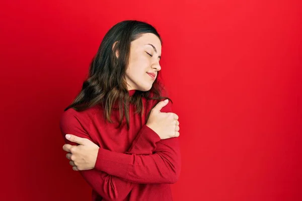 Young Brunette Woman Wearing Turtleneck Sweater Hugging Oneself Happy Positive — Stock Fotó