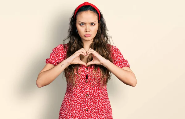 Young Hispanic Girl Doing Heart Symbol Hands Skeptic Nervous Frowning — Stock Photo, Image