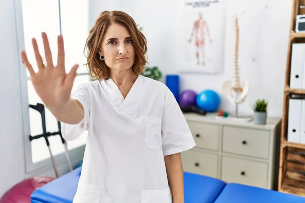 Middle Age Physiotherapist Woman Working Pain Recovery Clinic Doing Stop — 图库照片