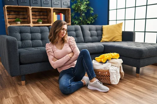 Young Woman Unhappy Doing Laundry Home — Stockfoto